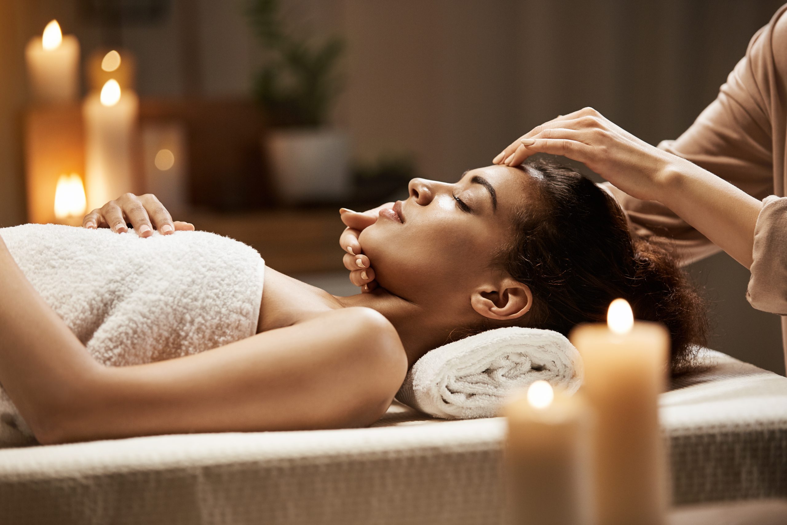 Facilities 17 attractive african woman enjoying face massage spa salon scaled 1